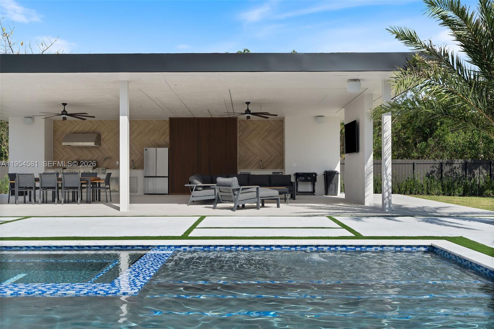 12425 Southwest 226th Street Miami, FL 33170 - Photo 27 of 75 a view of swimming pool with outdoor seating