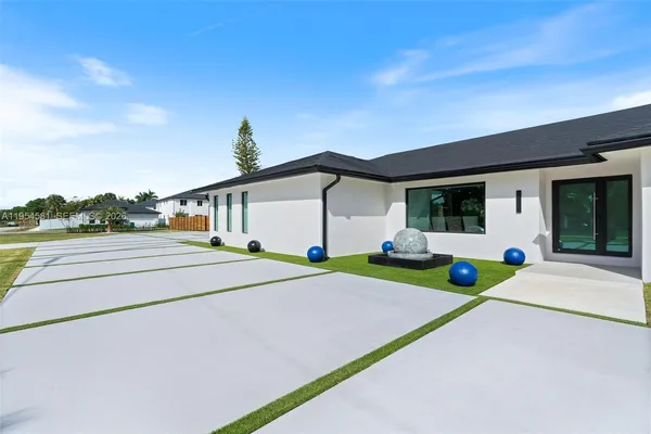 an aerial view of a house with swimming pool