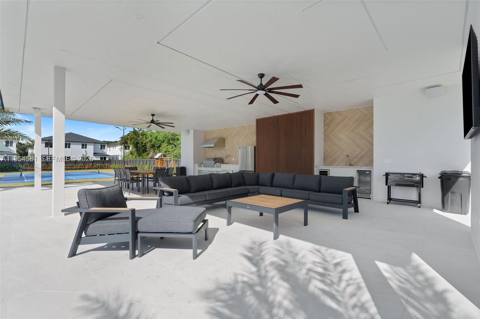 12425 Southwest 226th Street Miami, FL 33170 - Photo 33 of 75 a living room with furniture and a large window