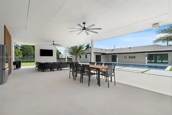 a view of an entryway with wooden floor and a floor to ceiling window