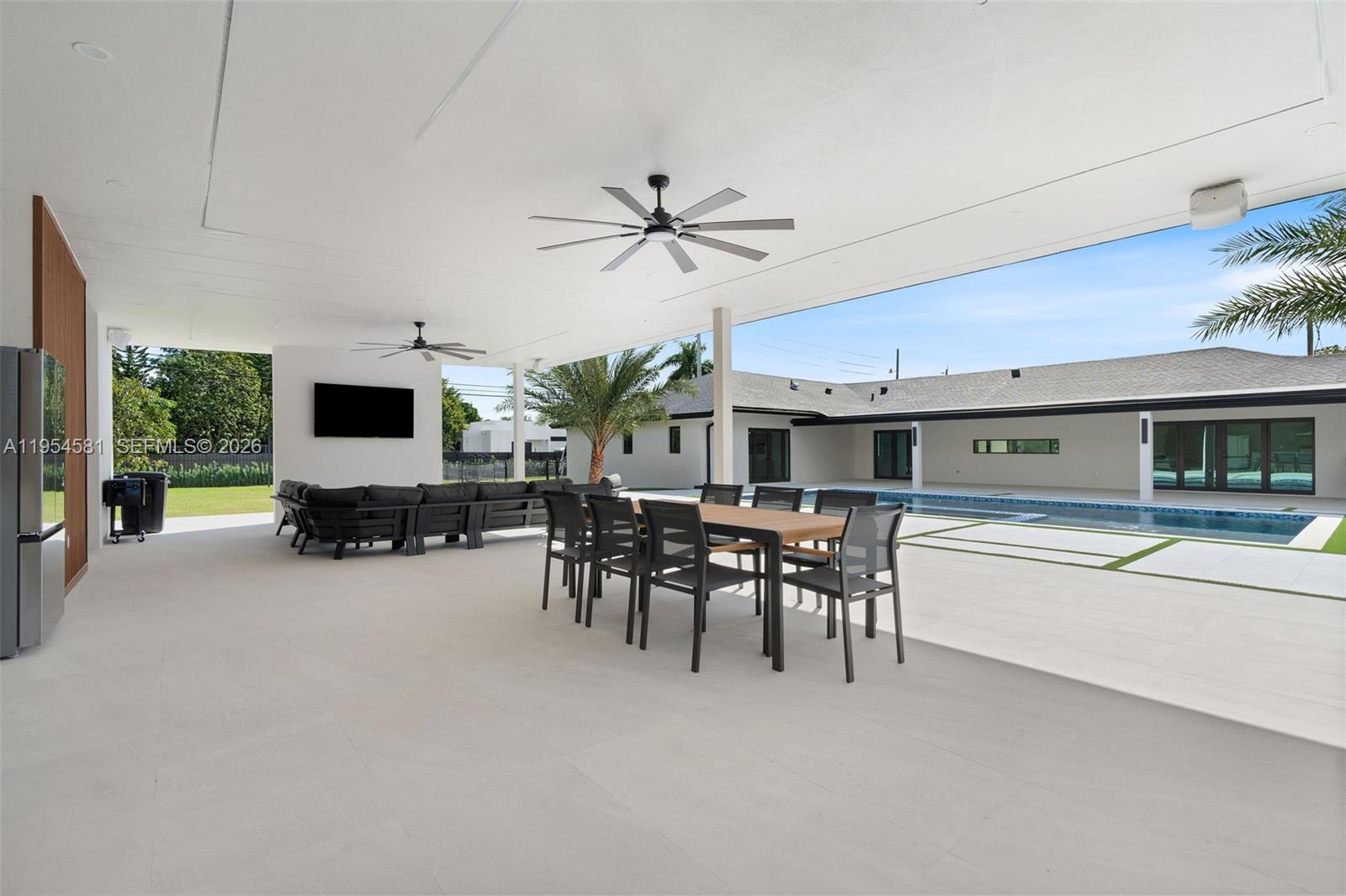 12425 Southwest 226th Street Miami, FL 33170 - Photo 36 of 75 a view of a livingroom with furniture and a flat screen tv
