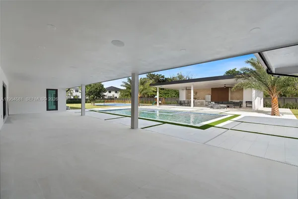 a bathroom with a double vanity sink a toilet and a mirror
