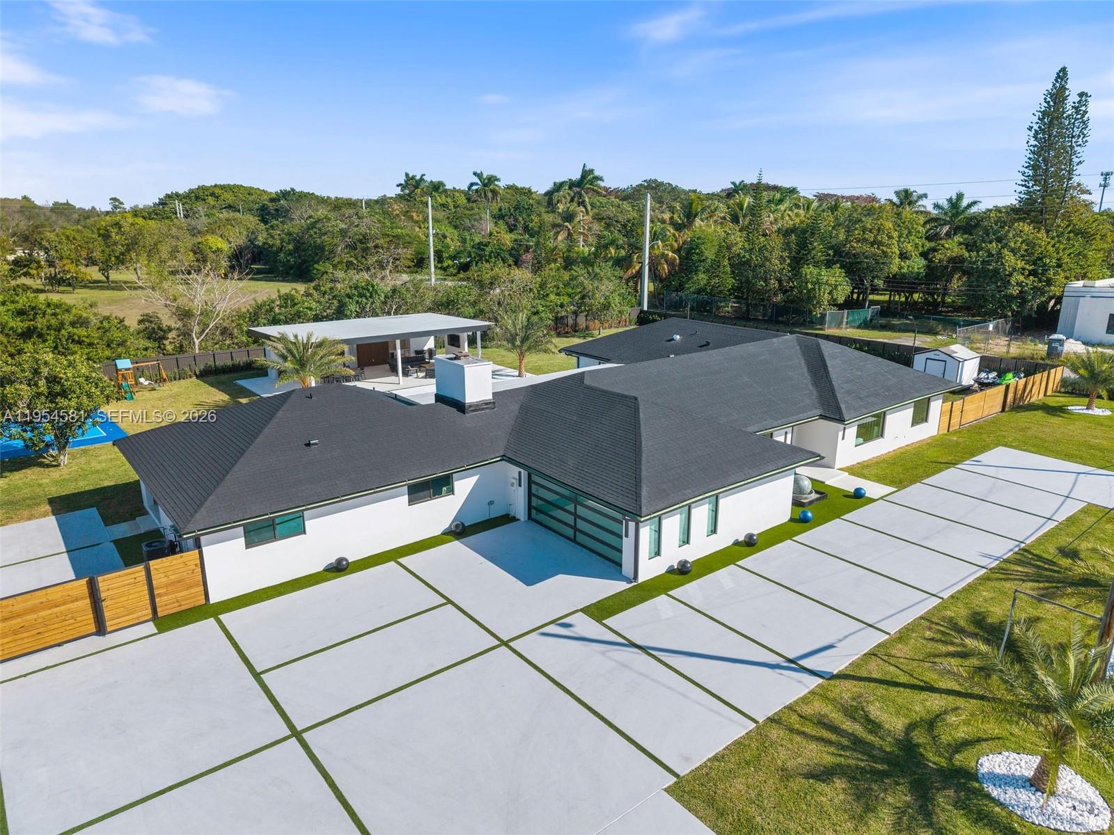 12425 Southwest 226th Street Miami, FL 33170 - Photo 4 of 75 an aerial view of a house with swimming pool