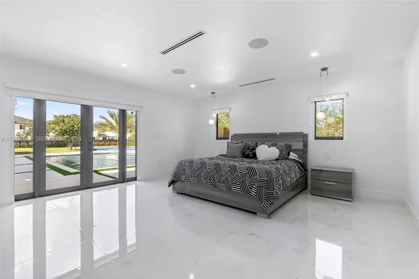 a swimming pool with lots of tress in front of it