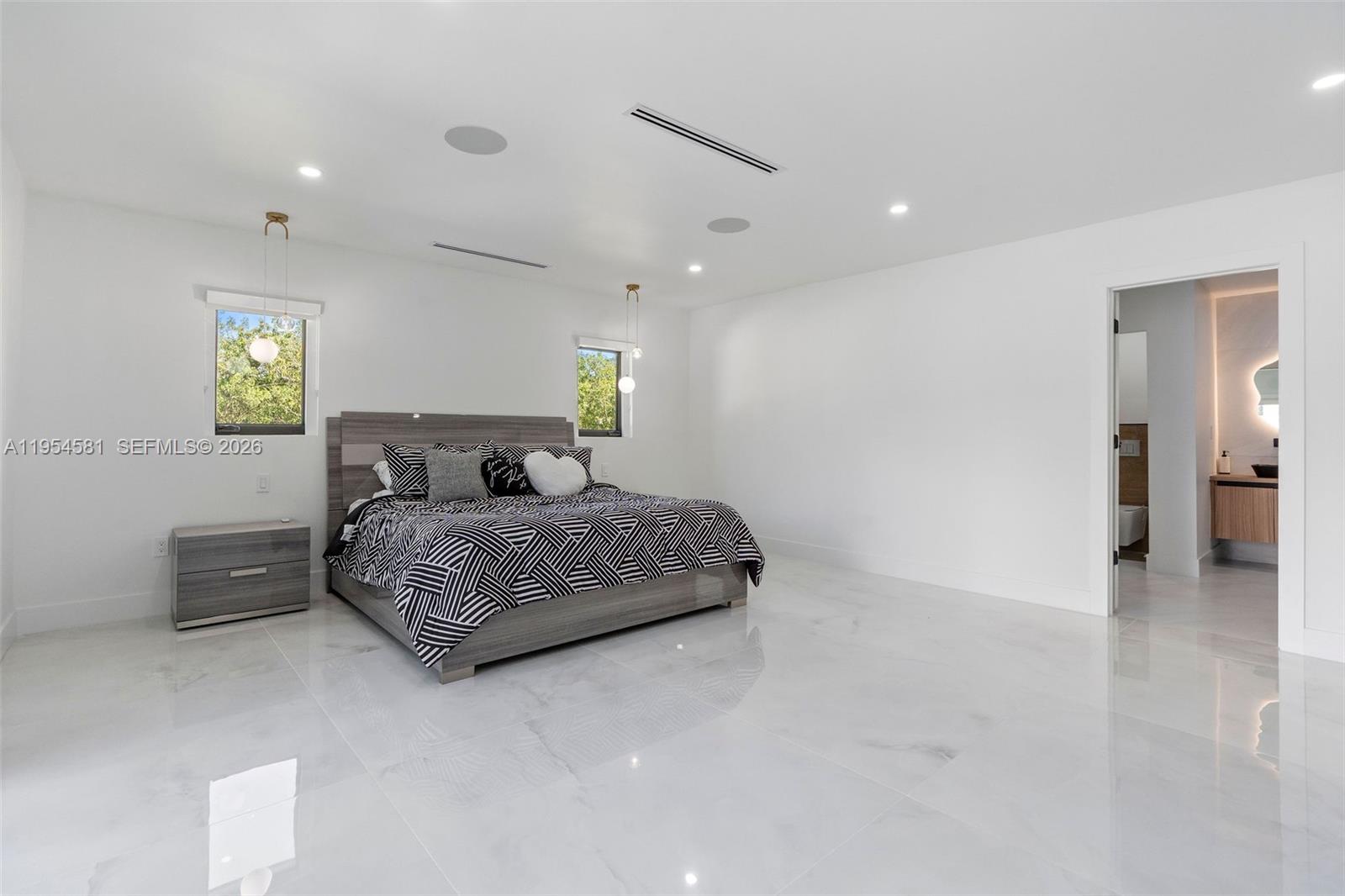 12425 Southwest 226th Street Miami, FL 33170 - Photo 45 of 75 a bedroom with a bed and a view of kitchen