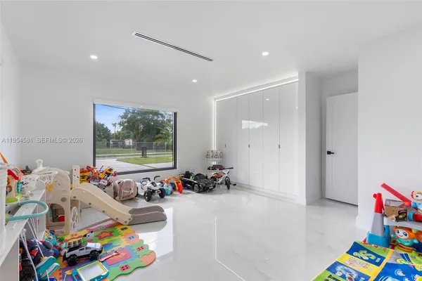 a view of a swimming pool with a yard