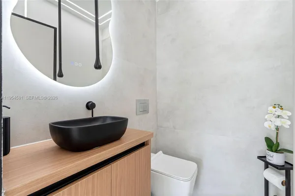 an aerial view of a house with a swimming pool outdoor seating and yard