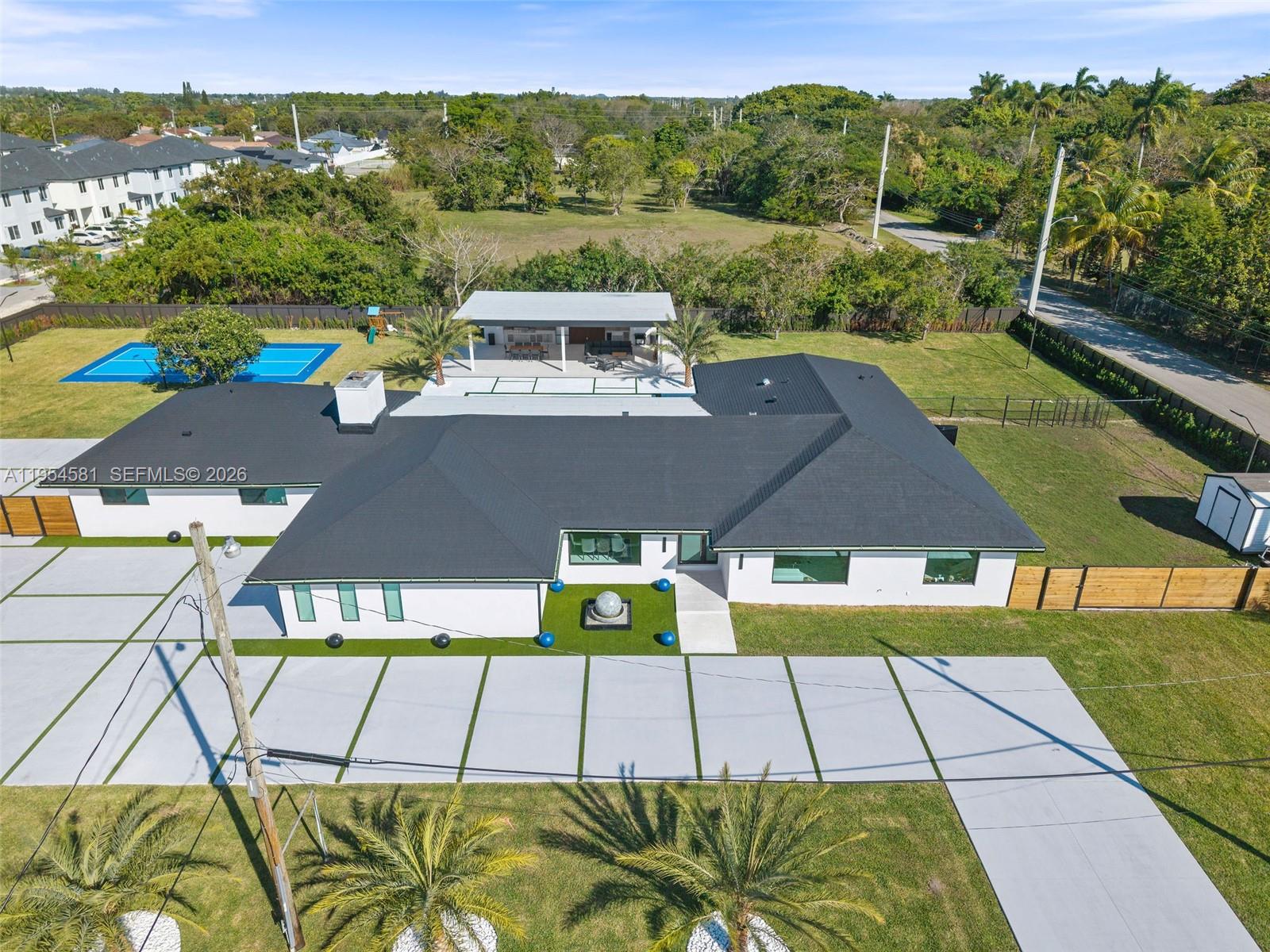12425 Southwest 226th Street Miami, FL 33170 - Photo 5 of 75 a view of an chairs and table in the terrace