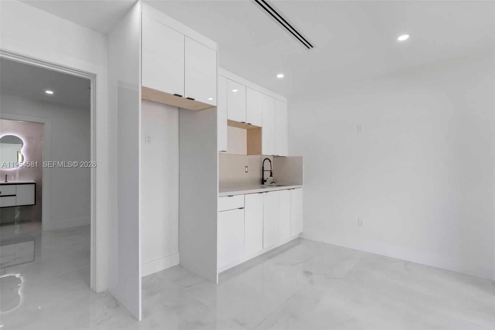 12425 Southwest 226th Street Miami, FL 33170 - Photo 57 of 75 a bathroom with a granite countertop sink mirror and vanity