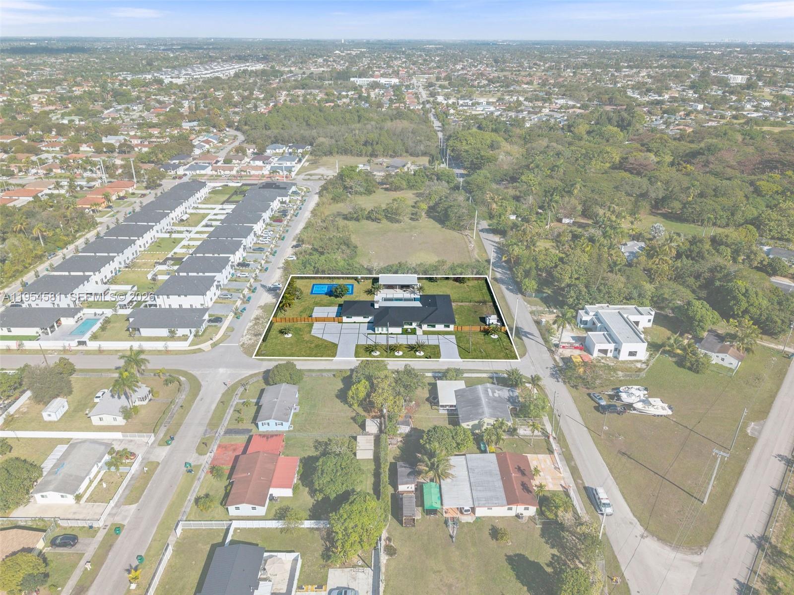 12425 Southwest 226th Street Miami, FL 33170 - Photo 72 of 75 an aerial view of residential houses with outdoor space