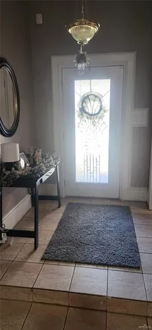 a view of a livingroom with wooden floor and a window