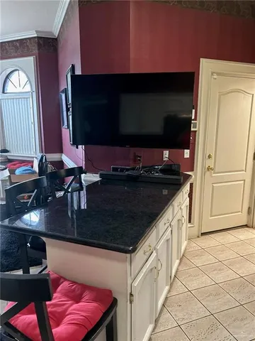 a kitchen with stainless steel appliances granite countertop a sink and a microwave