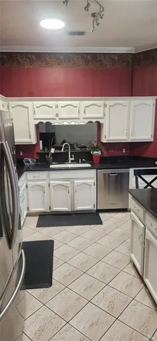 a kitchen with a stove and cabinets