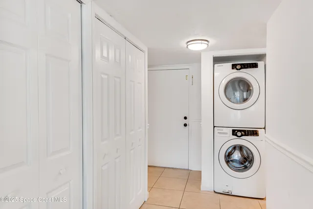 a utility room with sink dryer and washer