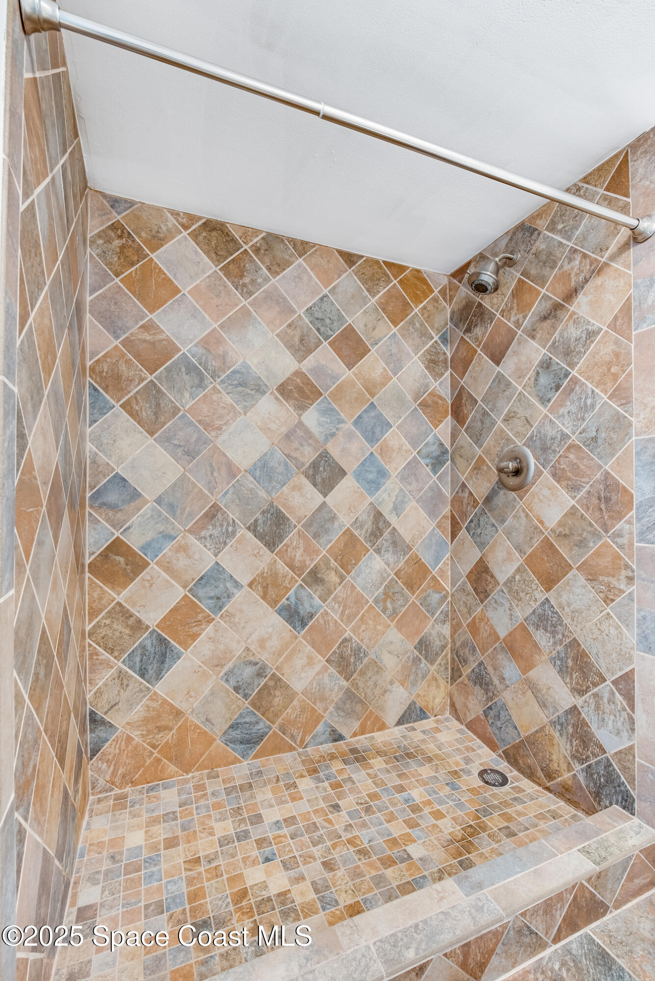 315 Tangle Run Boulevard, Unit 1023 Melbourne, FL 32940 - Photo 15 of 17 a bathroom with a shower