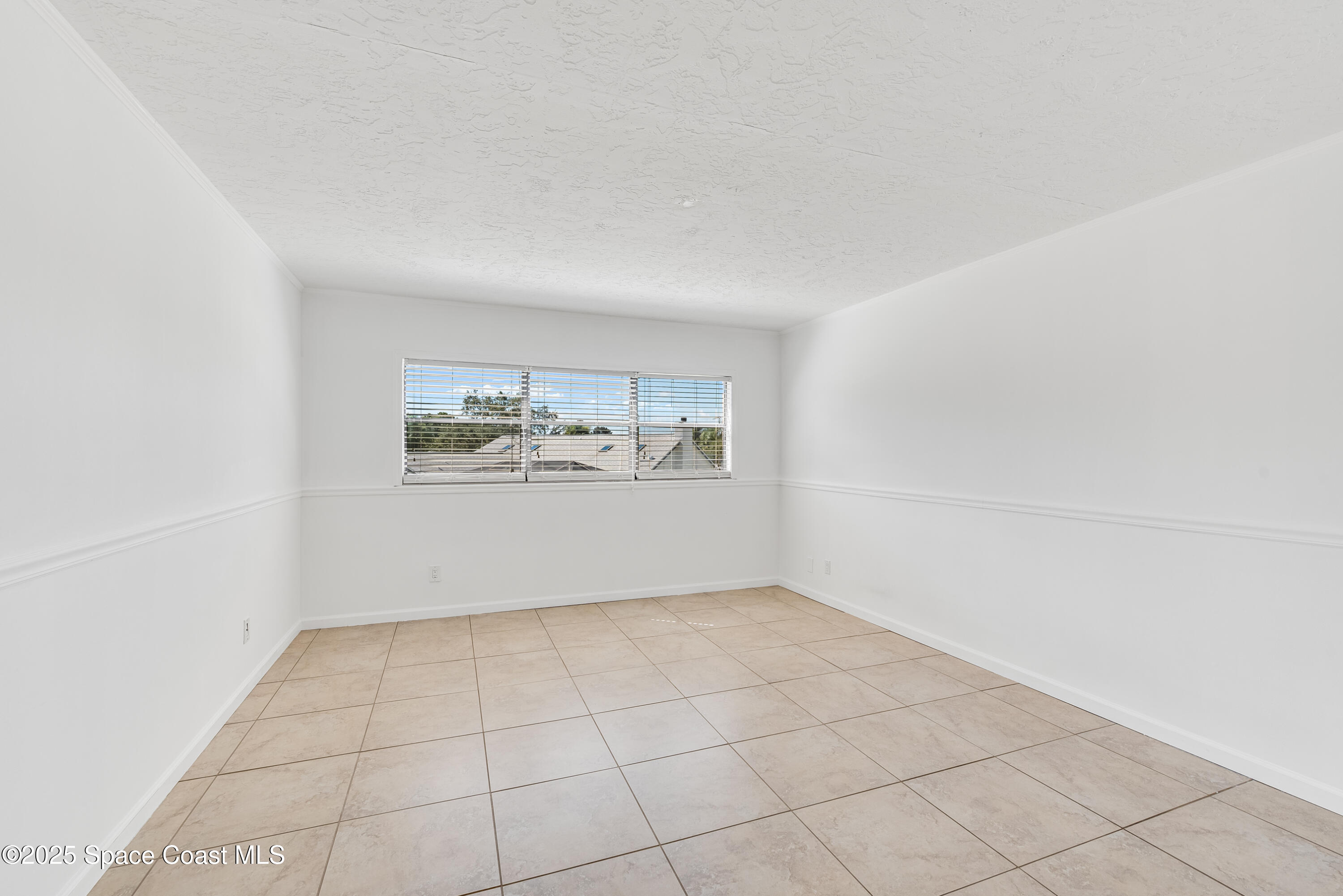 315 Tangle Run Boulevard, Unit 1023 Melbourne, FL 32940 - Photo 16 of 17 a view of an empty room