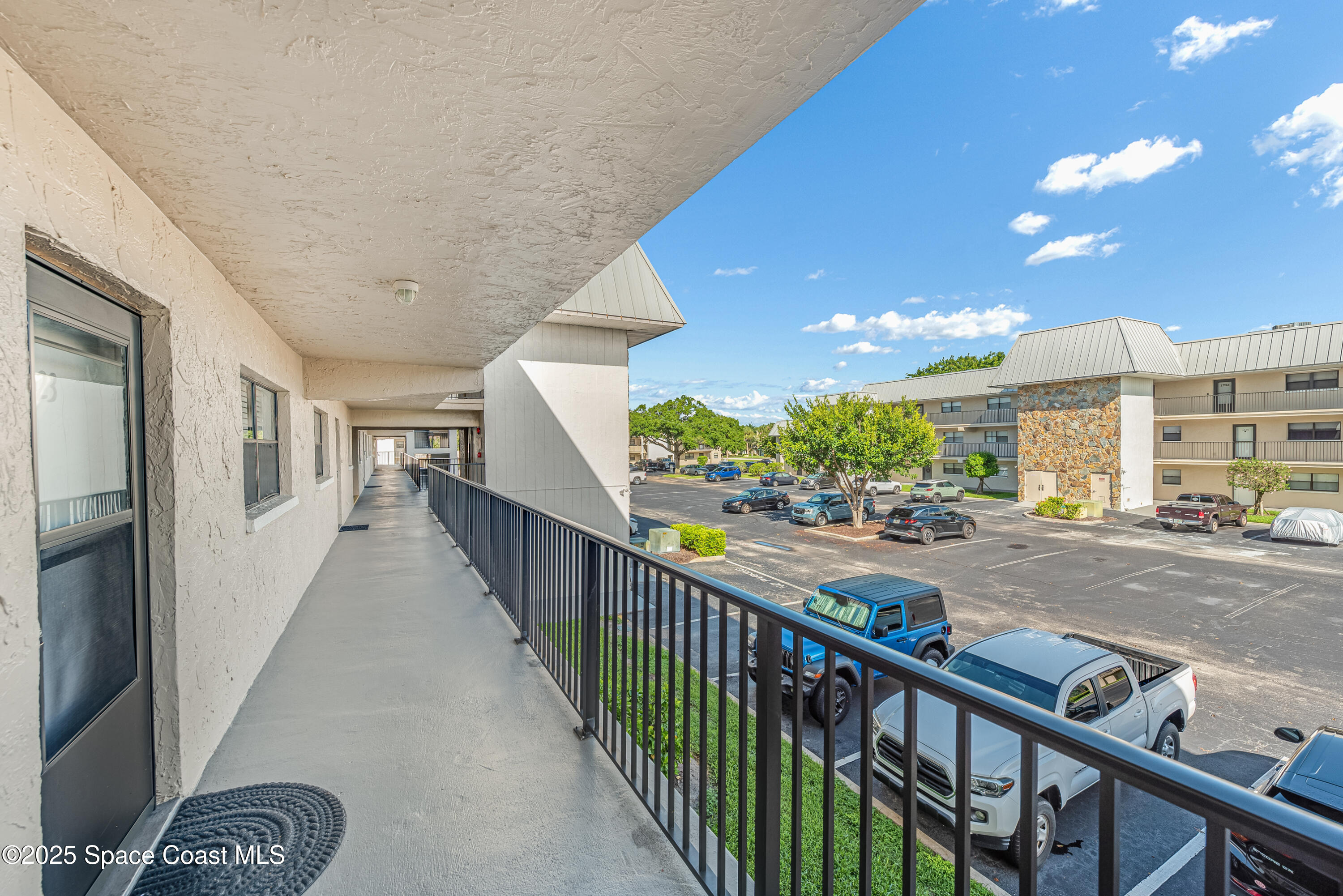 315 Tangle Run Boulevard, Unit 1023 Melbourne, FL 32940 - Photo 2 of 17 a view of a porch