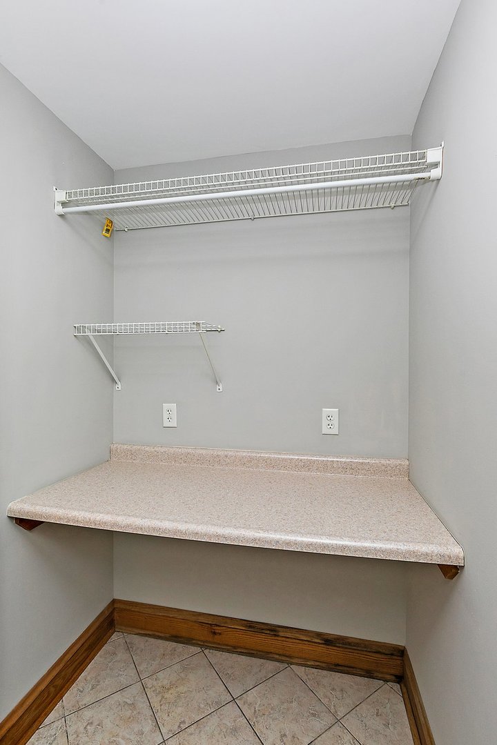 5N988 Meredith Road Maple Park, IL 60151 - Photo 14 of 38 a close view of utility room with racks on the wall