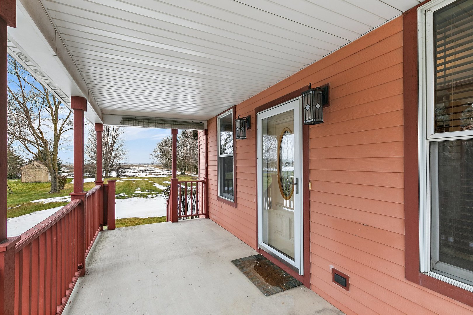 5N988 Meredith Road Maple Park, IL 60151 - Photo 2 of 38 a porch with a table and chairs next to a yard