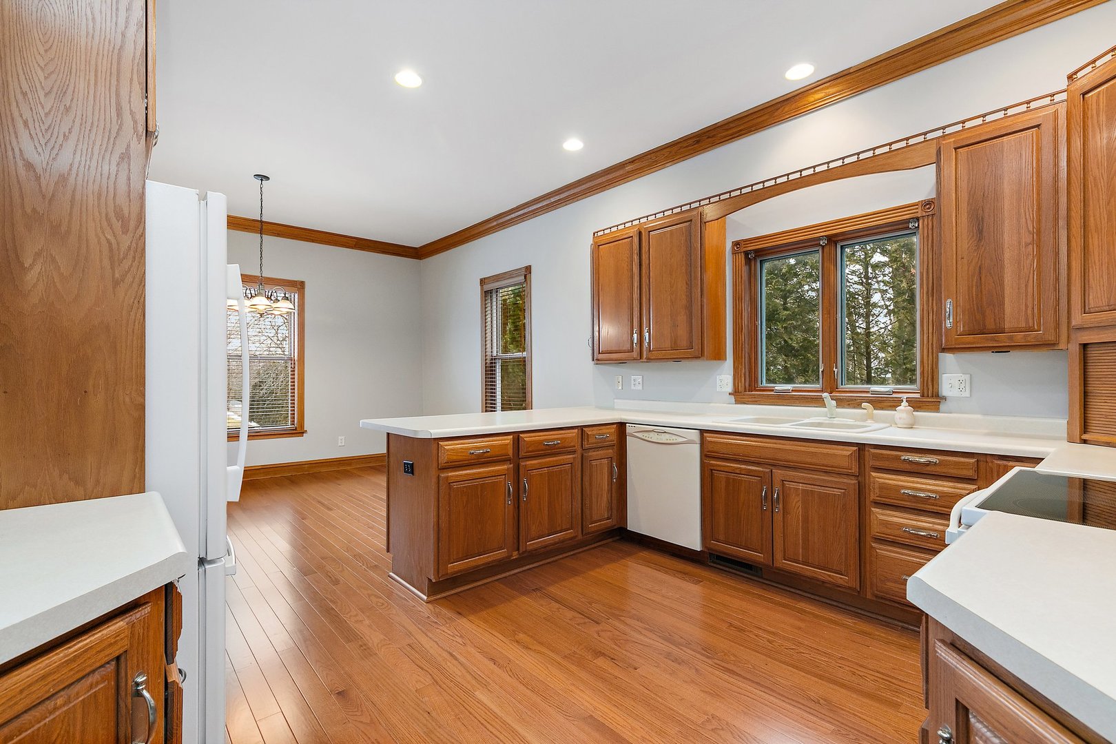 5N988 Meredith Road Maple Park, IL 60151 - Photo 7 of 38 a large kitchen with wooden floors and stainless steel appliances