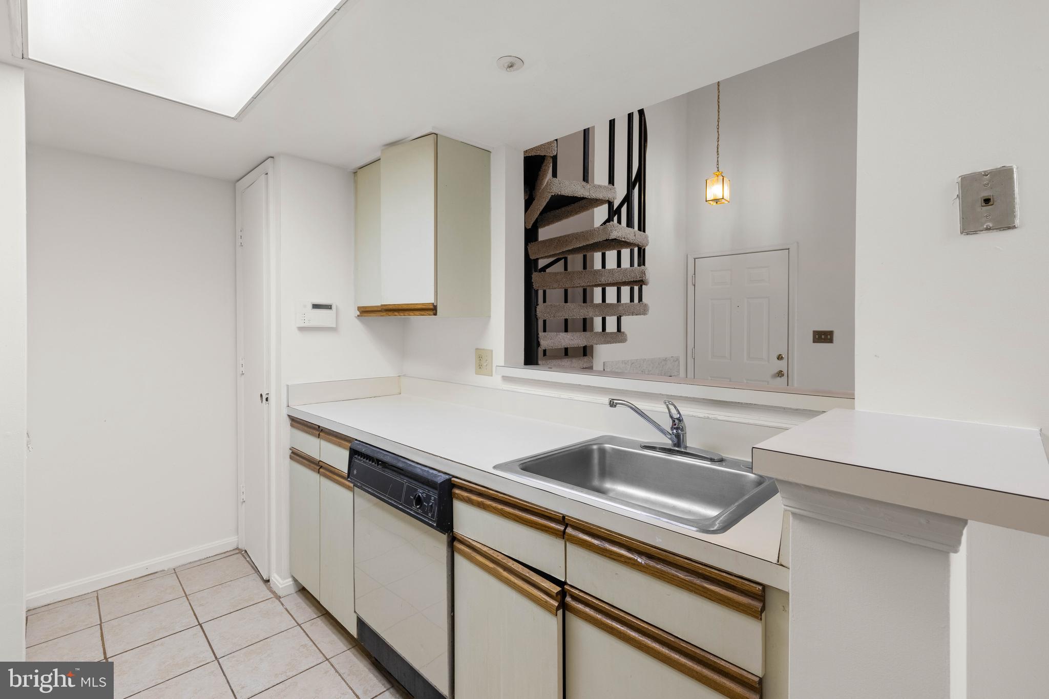 10419 Beacon Ridge Drive, Unit 302 Bowie, MD 20721 - Photo 11 of 26 Kitchen with Pass-through to Living Room