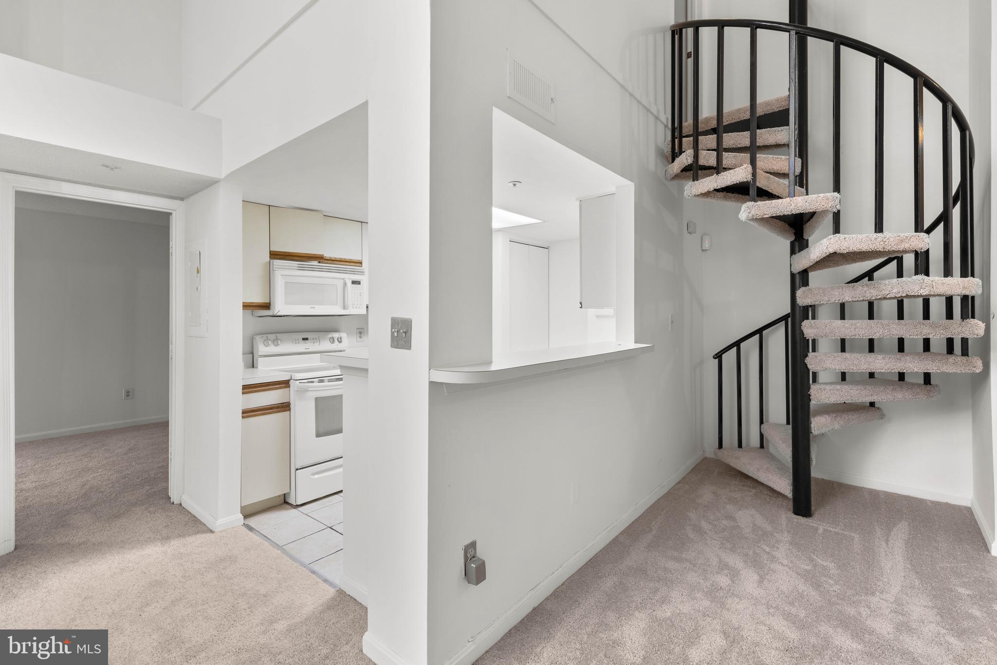 10419 Beacon Ridge Drive, Unit 302 Bowie, MD 20721 - Photo 26 of 26 Open Floor Plan with Spiral Staircase to Loft