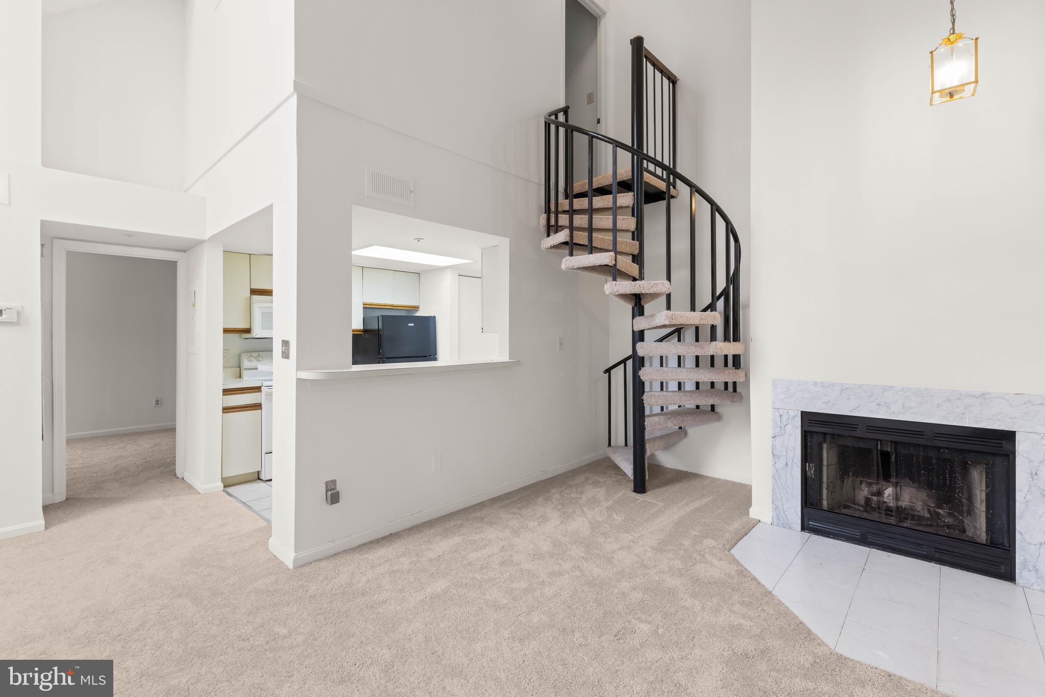 10419 Beacon Ridge Drive, Unit 302 Bowie, MD 20721 - Photo 4 of 26 Living Room with Cathedral Ceilings and Fireplace