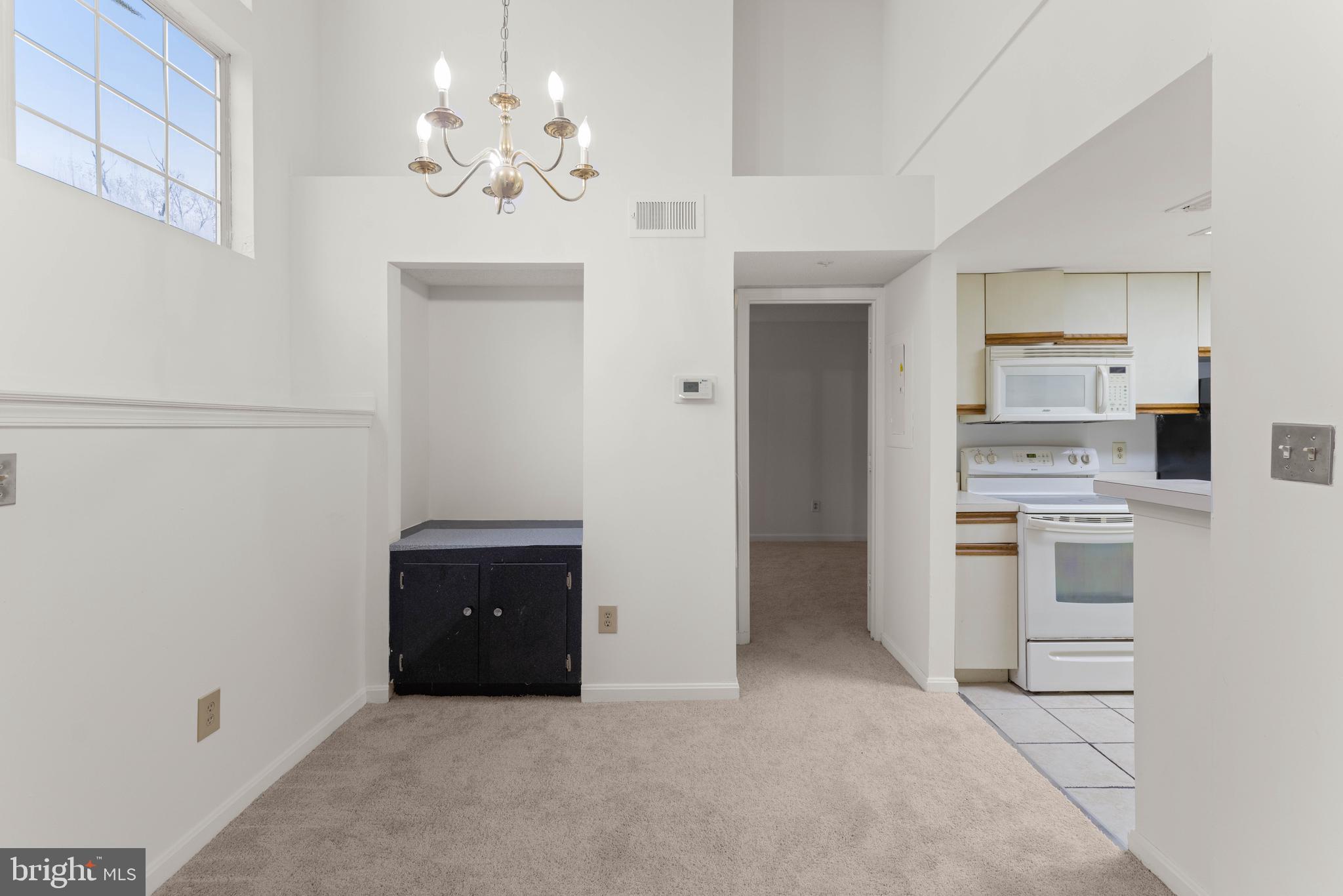 10419 Beacon Ridge Drive, Unit 302 Bowie, MD 20721 - Photo 5 of 26 Dining Room with Cathedral Ceilings