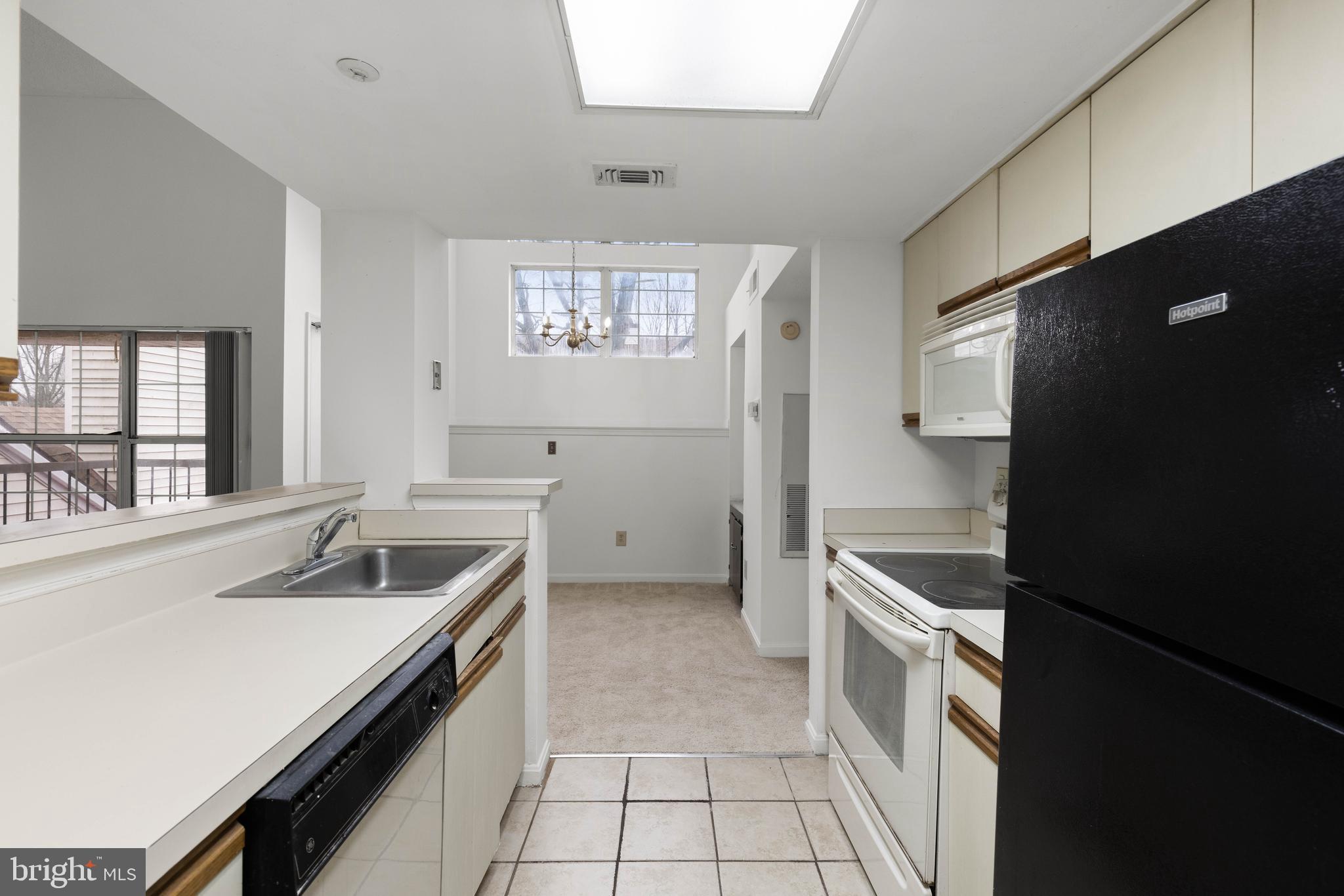 10419 Beacon Ridge Drive, Unit 302 Bowie, MD 20721 - Photo 7 of 26 Kitchen View into Dining Room