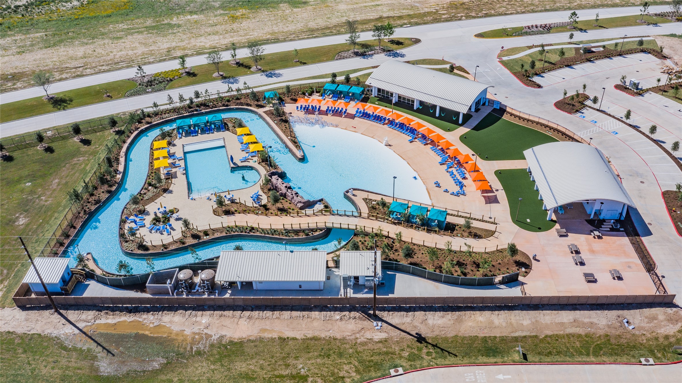 3806 Shackleton Court Rosharon, TX 77583 - Photo 43 of 50 "This photo showcases the property's fantastic water amenities, including a lazy river, a thrilling wave pool, and a comfortable family pool complete with cabanas, perfect for relaxation and fun for all ages."