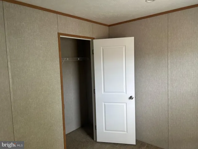 a view of a bathroom from a hallway