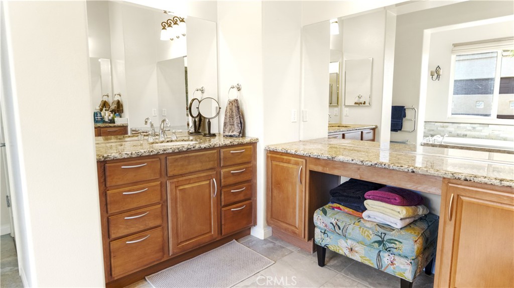 923 Union Street Cherry Valley, CA 92223 - Photo 25 of 68 a bathroom with a sink and a mirror