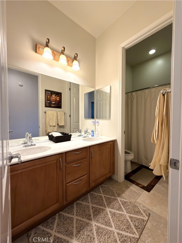 923 Union Street Cherry Valley, CA 92223 - Photo 31 of 68 a bathroom with a double vanity sink mirror and
