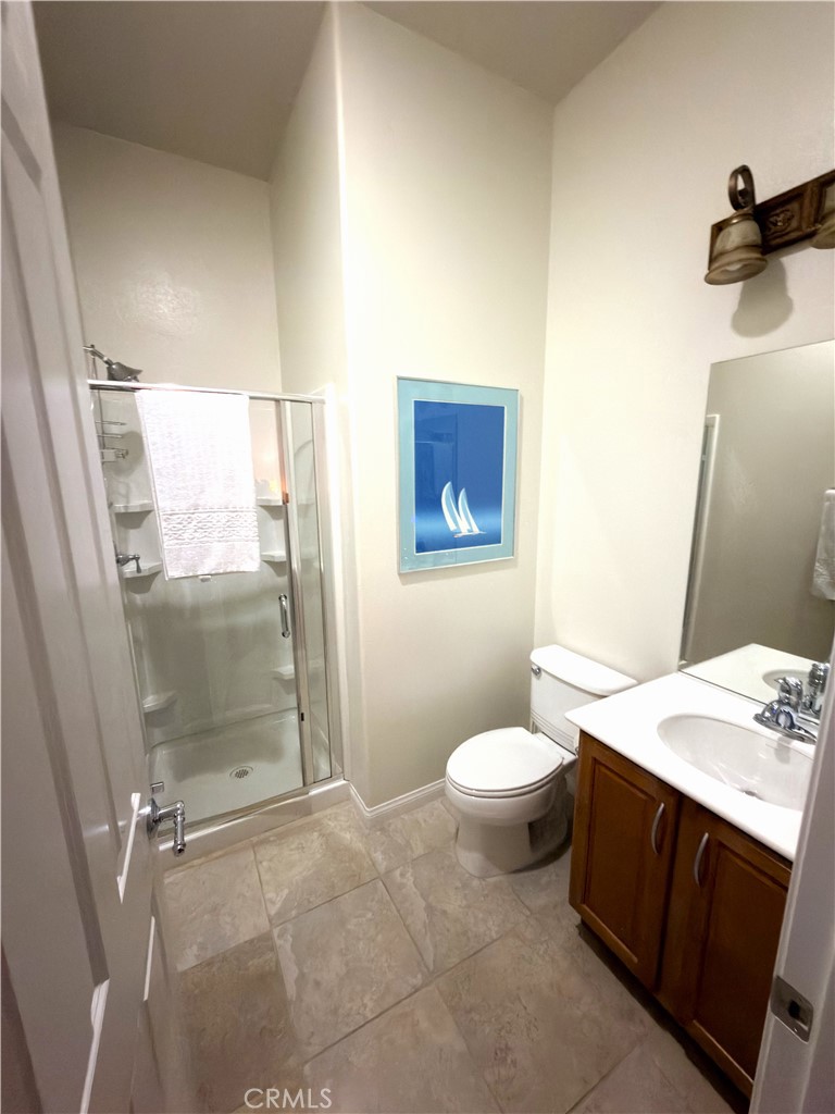 923 Union Street Cherry Valley, CA 92223 - Photo 33 of 68 a bathroom with a sink a toilet and shower