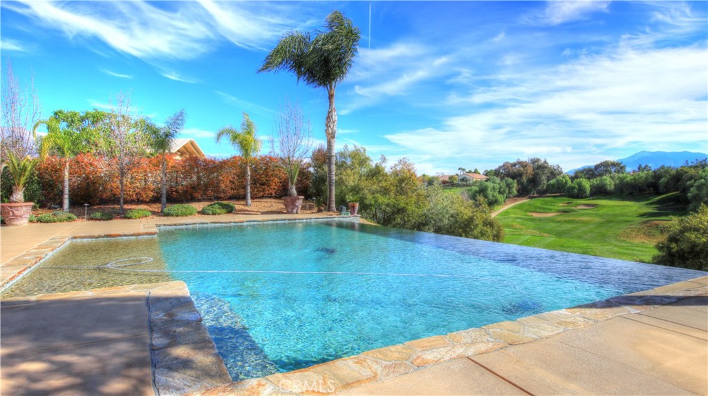 923 Union Street Cherry Valley, CA 92223 - Photo 61 of 68 a view of a swimming pool with a yard