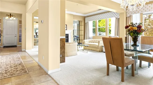 a very nice looking living room with a large window and furniture