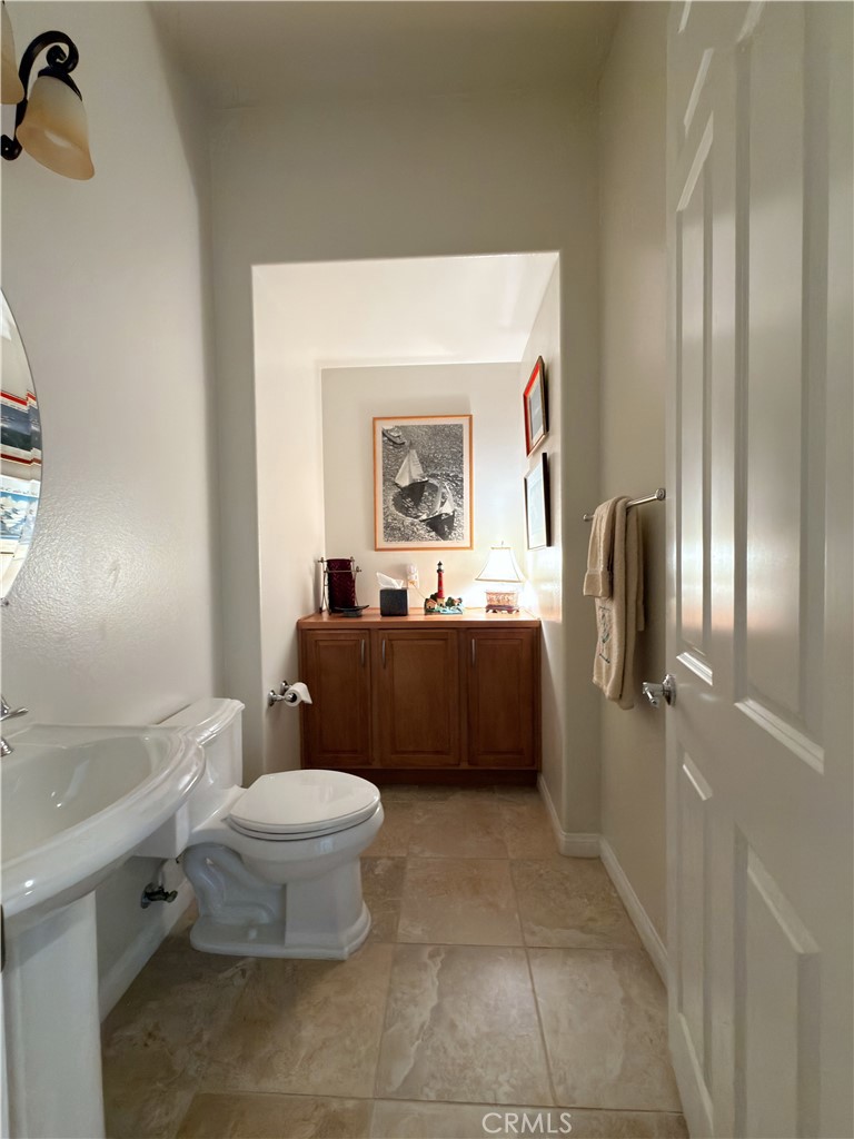 923 Union Street Cherry Valley, CA 92223 - Photo 10 of 68 a bathroom with a toilet sink and mirror