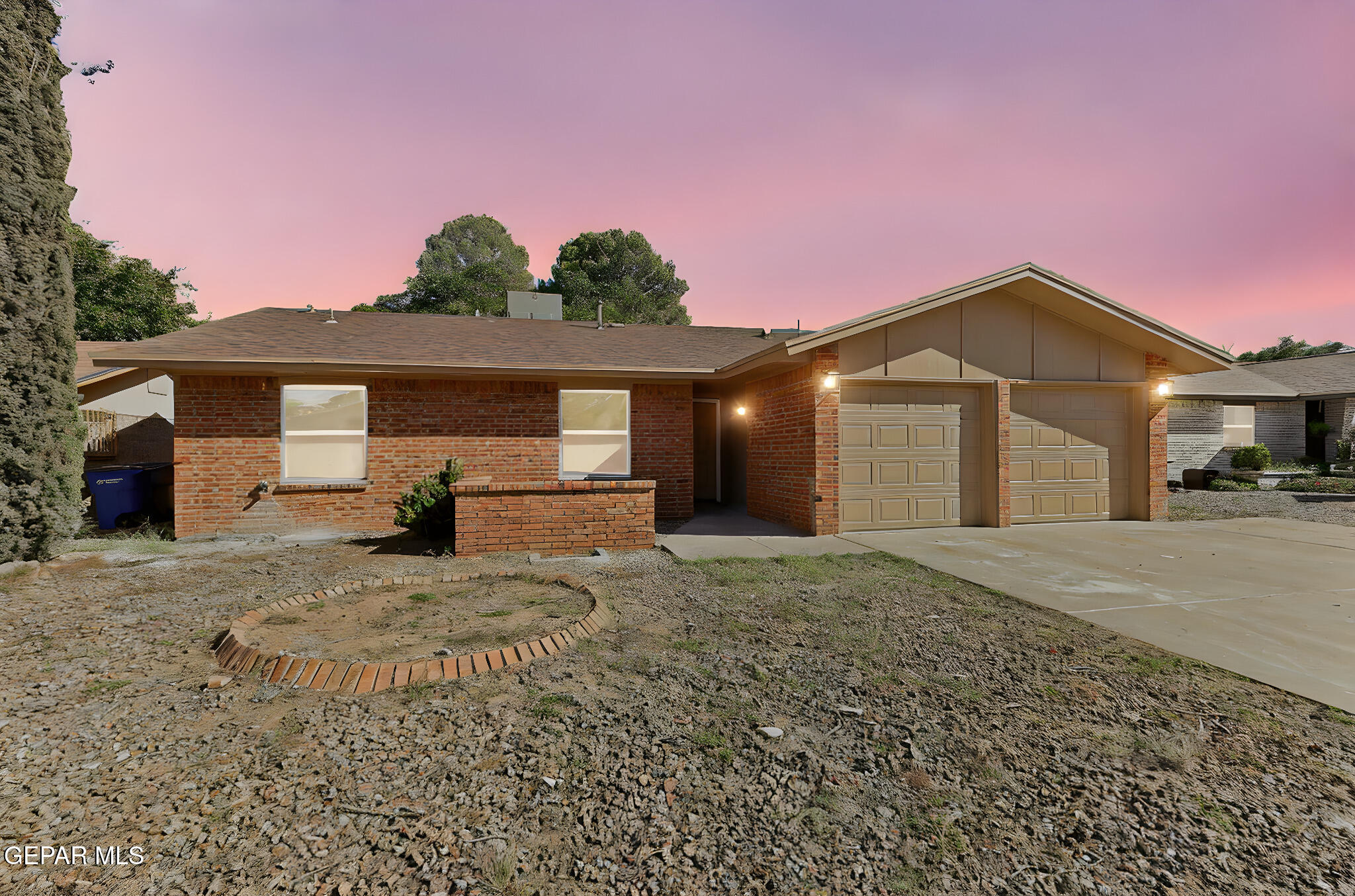 3428 Itasca Street El Paso, TX 79936 - Photo 1 of 34 a front view of a house with a yard and garage