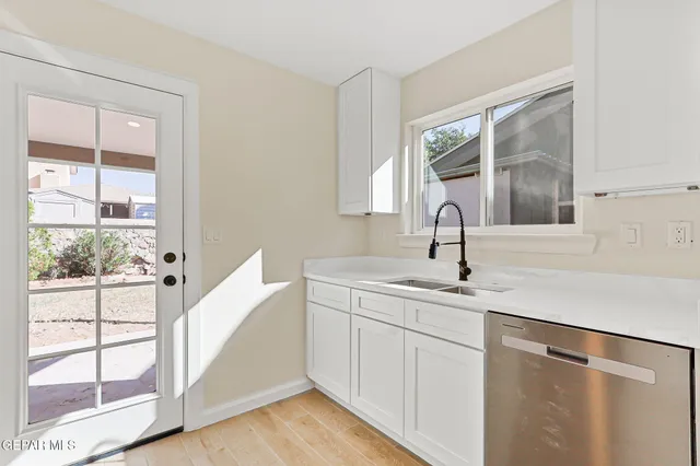 a kitchen with a sink and a window