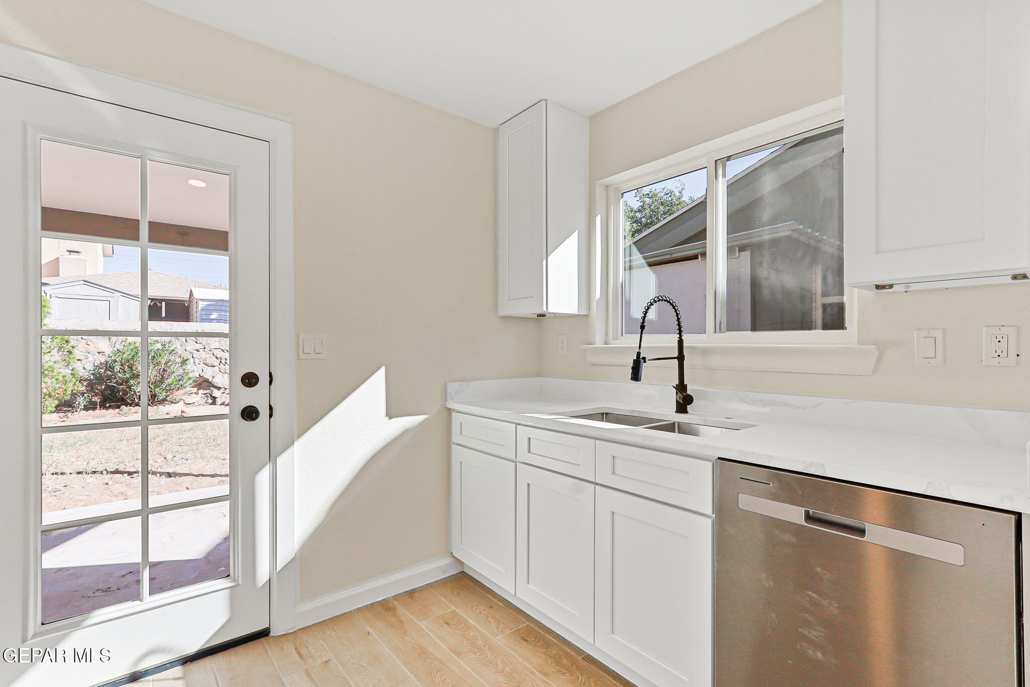 3428 Itasca Street El Paso, TX 79936 - Photo 13 of 34 a kitchen with a sink and cabinets