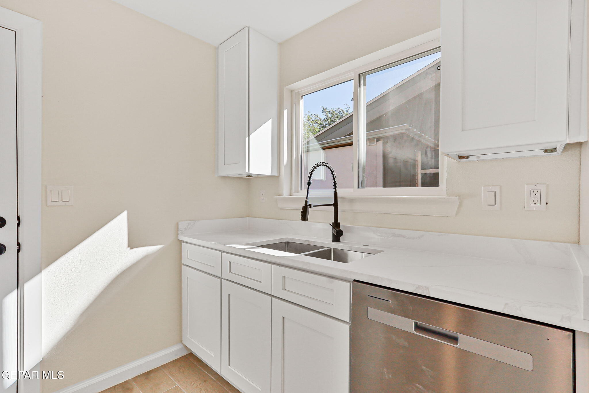 3428 Itasca Street El Paso, TX 79936 - Photo 14 of 34 a kitchen with a sink and a window