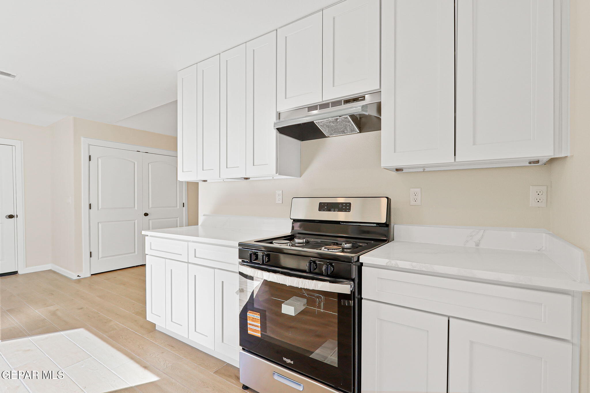 3428 Itasca Street El Paso, TX 79936 - Photo 15 of 34 a kitchen with granite countertop white cabinets and white appliances