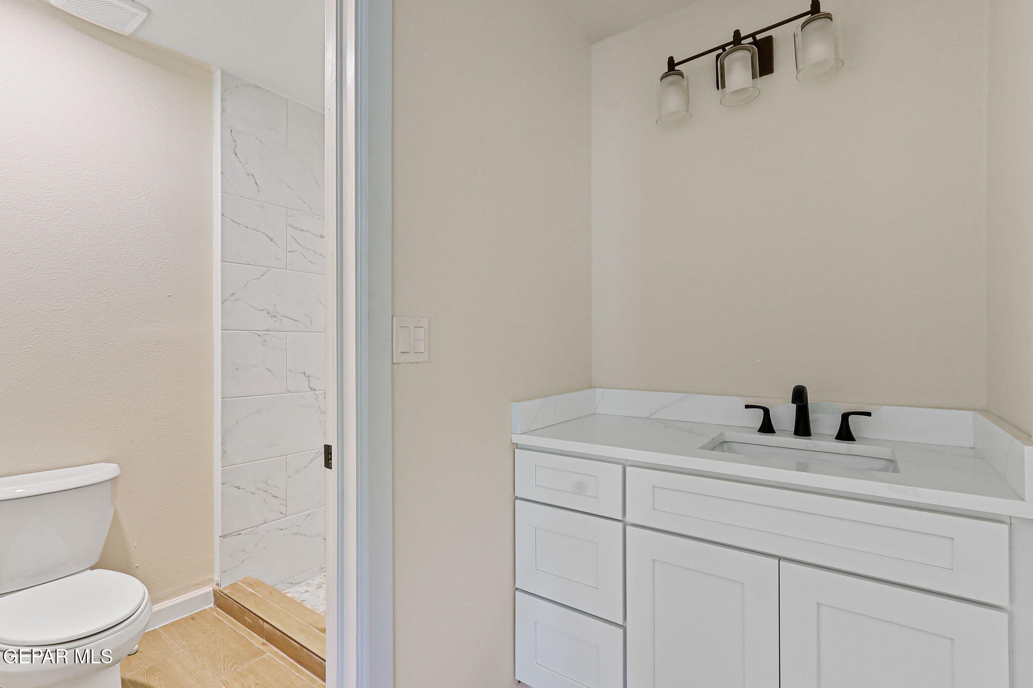 3428 Itasca Street El Paso, TX 79936 - Photo 18 of 34 a bathroom with a sink and a toilet