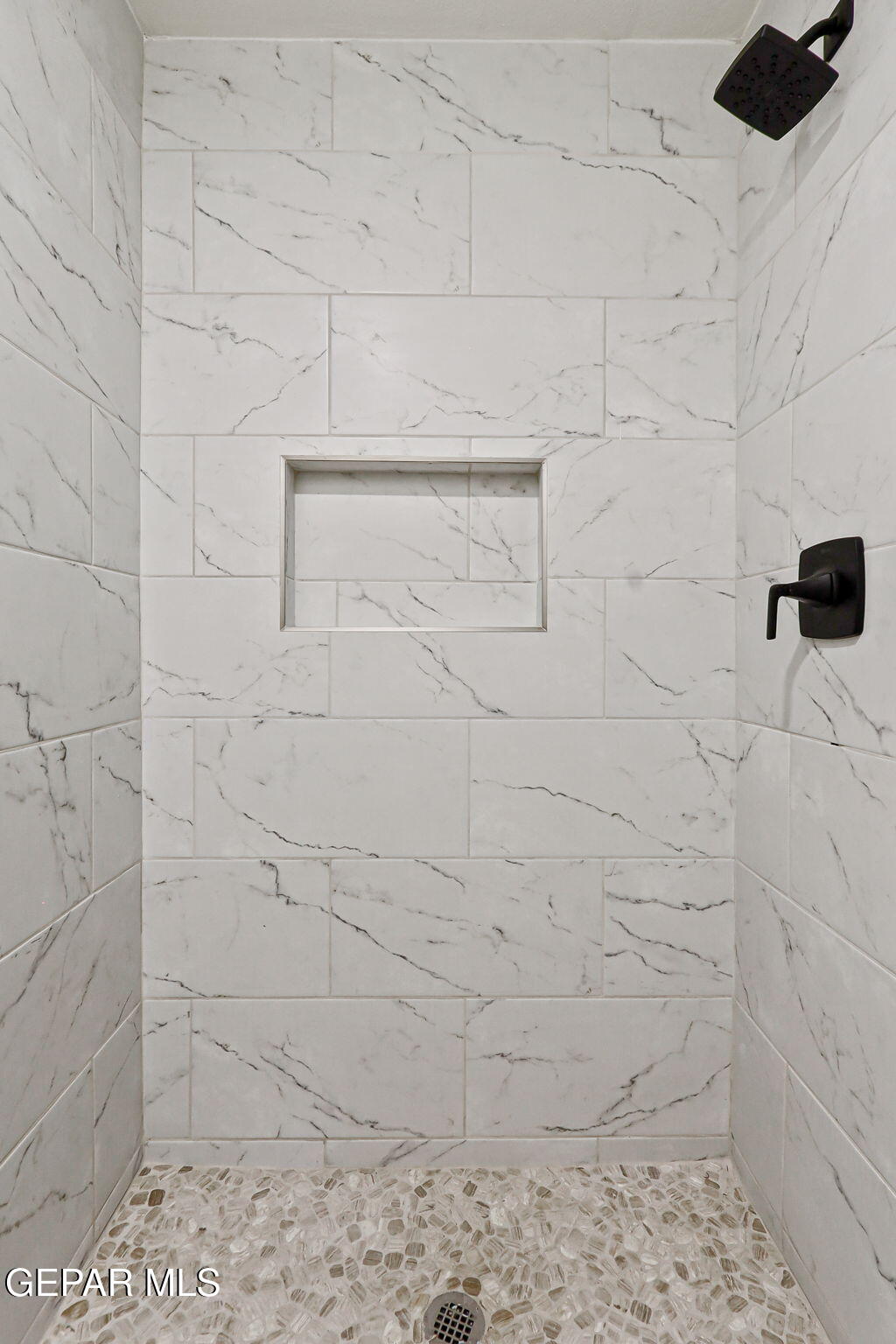 3428 Itasca Street El Paso, TX 79936 - Photo 19 of 34 a bathroom with a shower