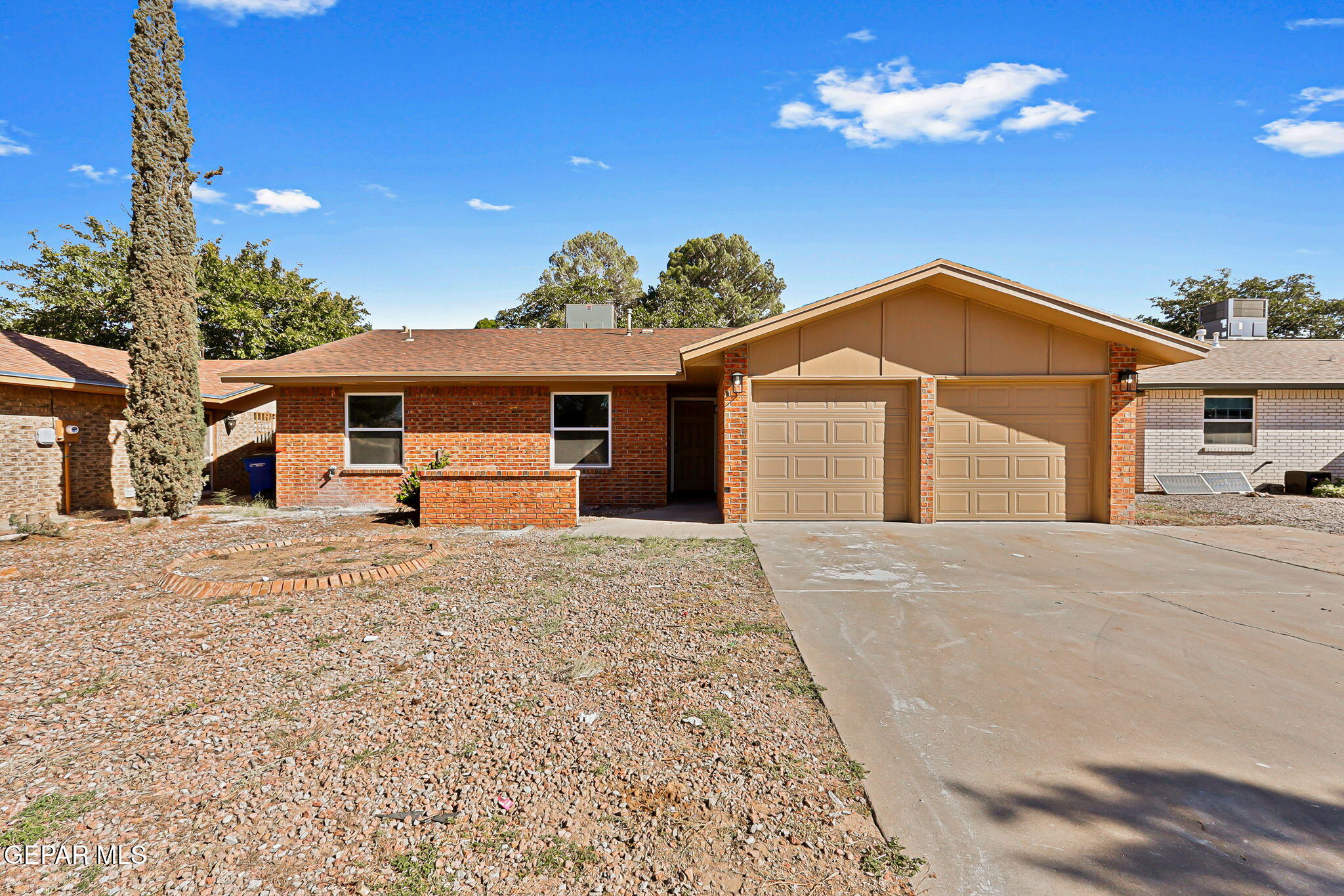 3428 Itasca Street El Paso, TX 79936 - Photo 2 of 34 a front view of a house with a yard and garage