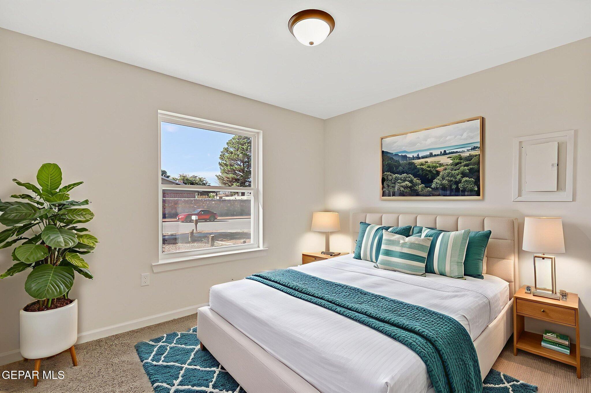 3428 Itasca Street El Paso, TX 79936 - Photo 23 of 34 a bedroom with a bed and a potted plant