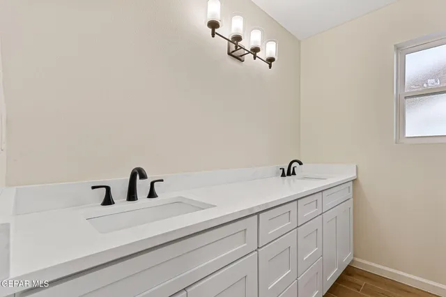 a bathroom with a sink and a mirror