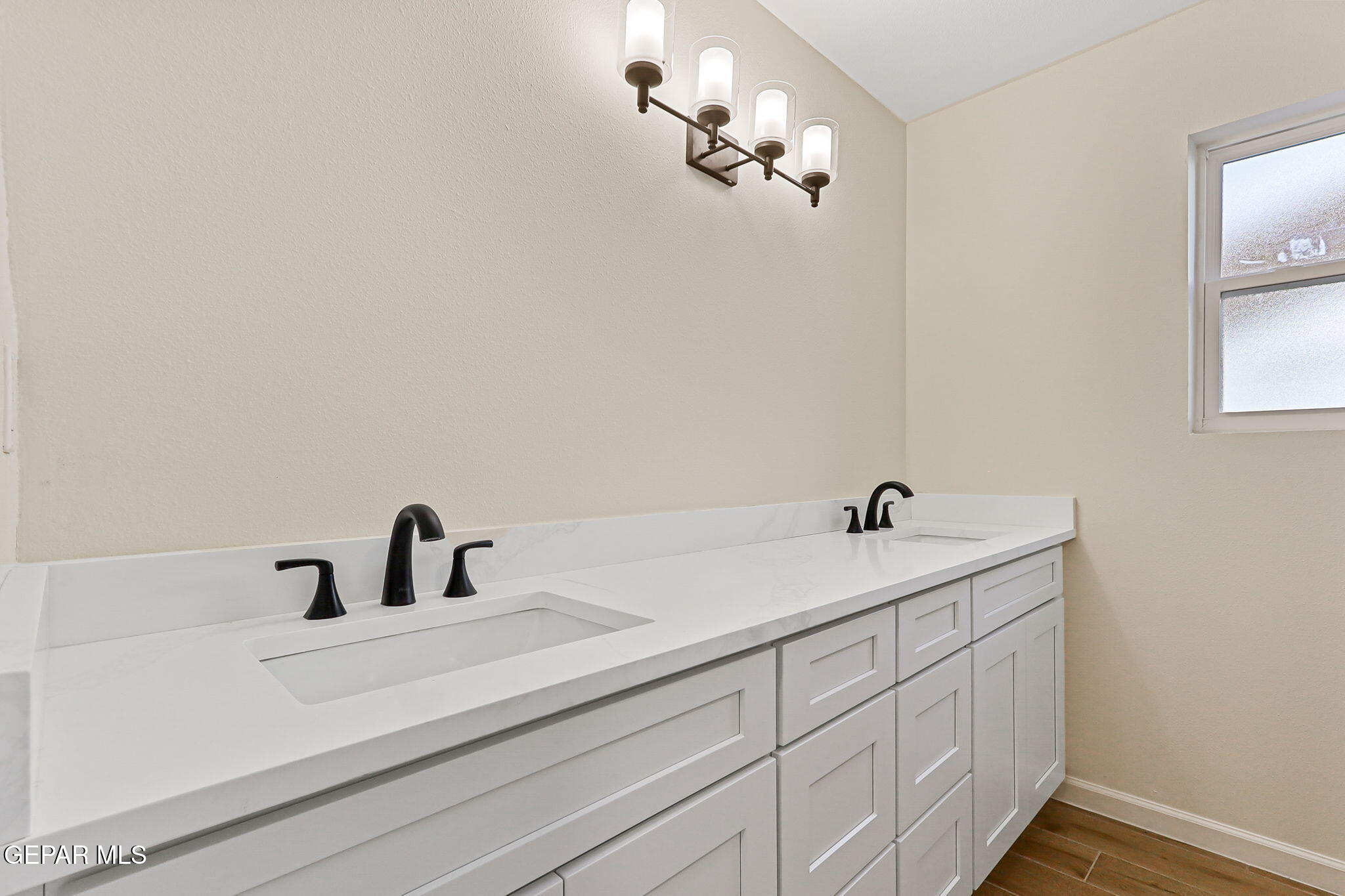 3428 Itasca Street El Paso, TX 79936 - Photo 26 of 34 a bathroom with a sink and a mirror