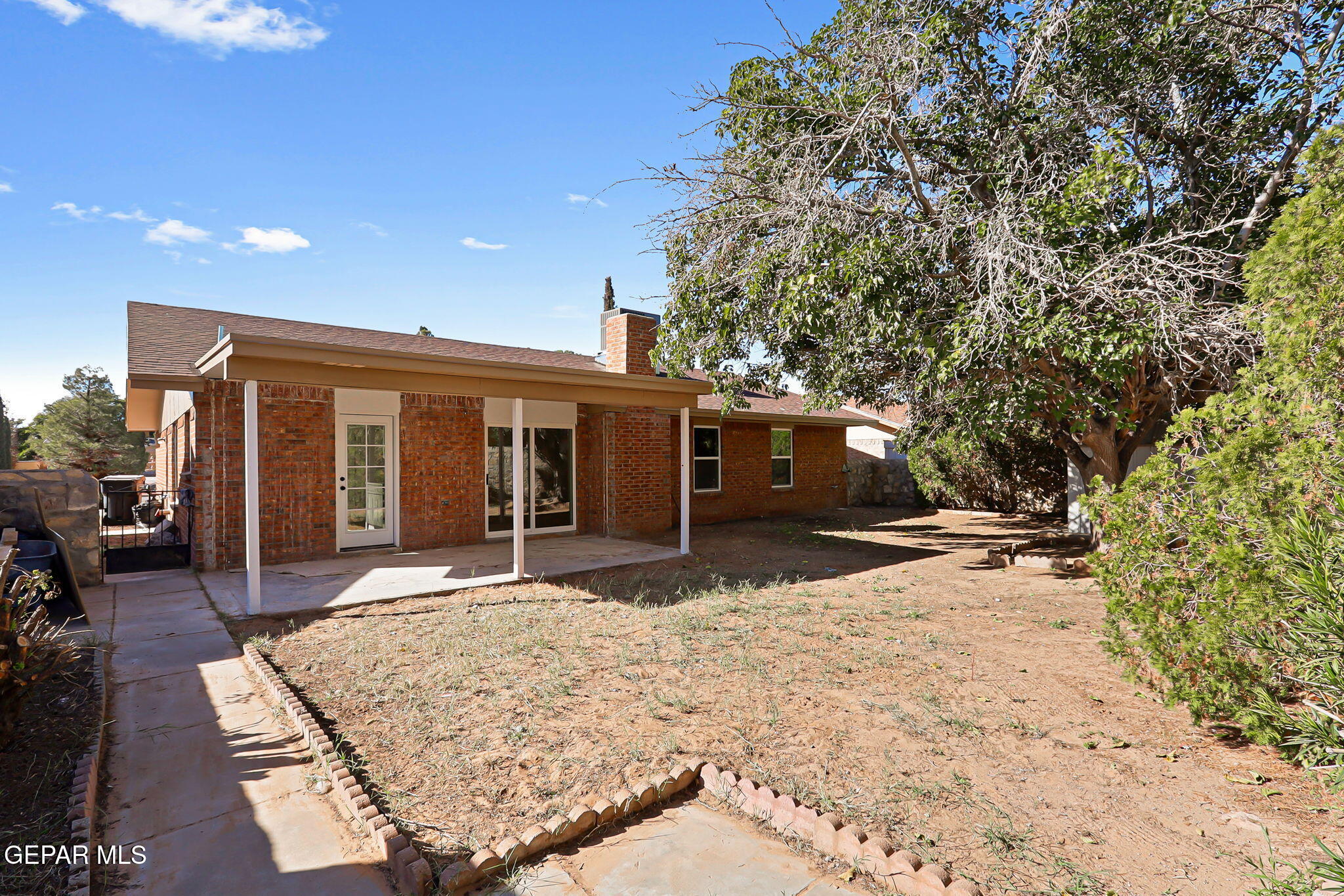 3428 Itasca Street El Paso, TX 79936 - Photo 30 of 34 a front view of a house with a yard and seating space