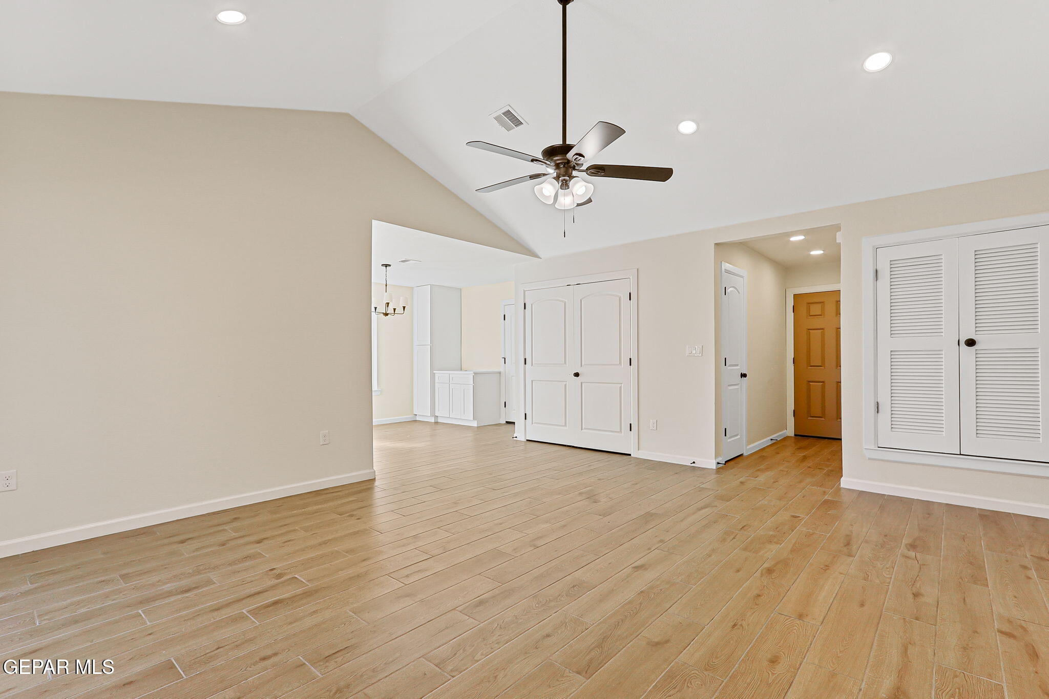 3428 Itasca Street El Paso, TX 79936 - Photo 6 of 34 a view of empty room with wooden floor and ceiling fan